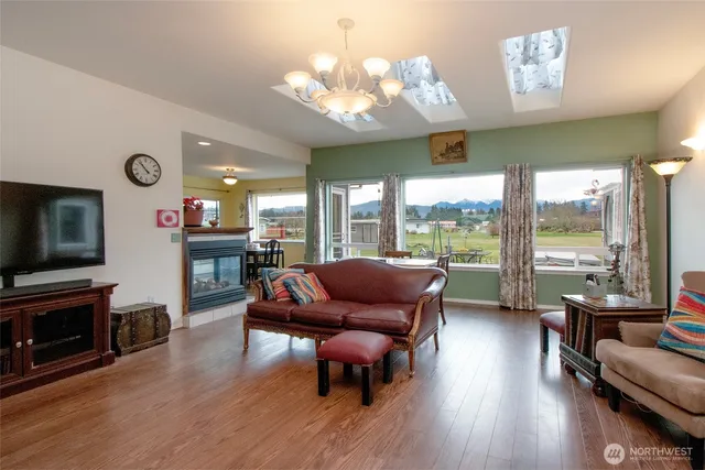 a living room with fireplace furniture and a flat screen tv