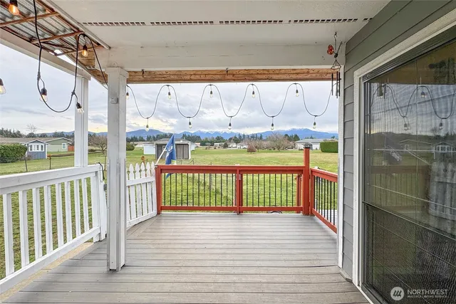 a view of a balcony with wooden floor