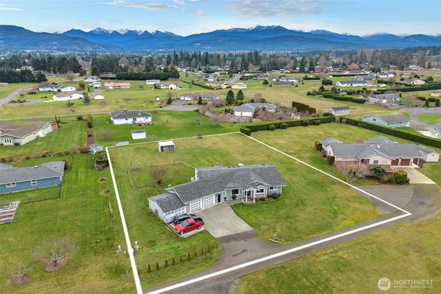 a view of a pool with a garden