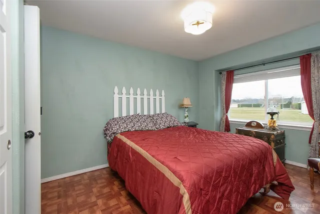 a bedroom with a bed and window