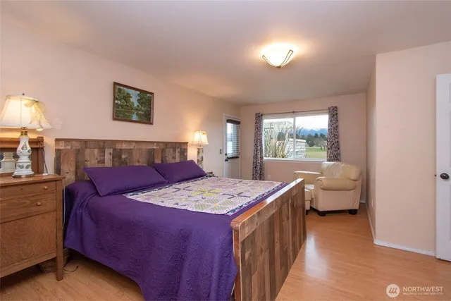 a bedroom with a bed and a couch