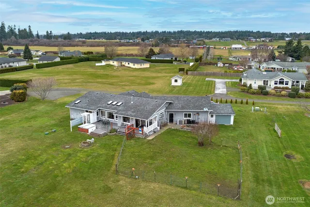 a aerial view of a house with a lake view