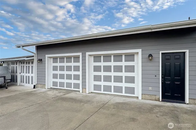 a front view of a house with a large window