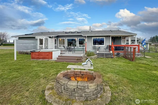 a front view of house with yard having outdoor seating