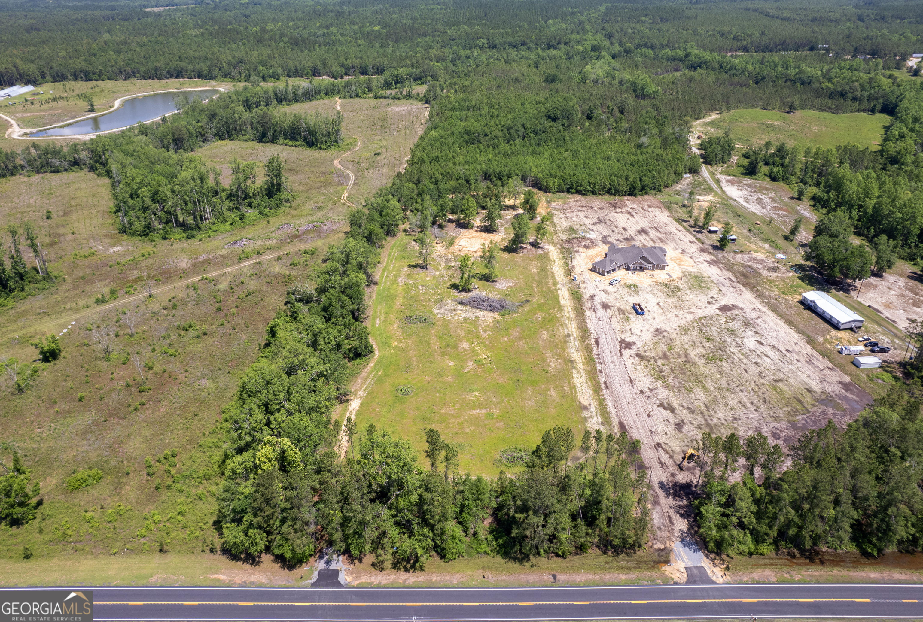 10-acre canvas in Odum-see cleared zones, trails, the pond, and wooded buffer all in one sweeping view.