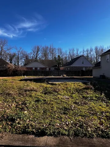 a view of a lake with outdoor seating