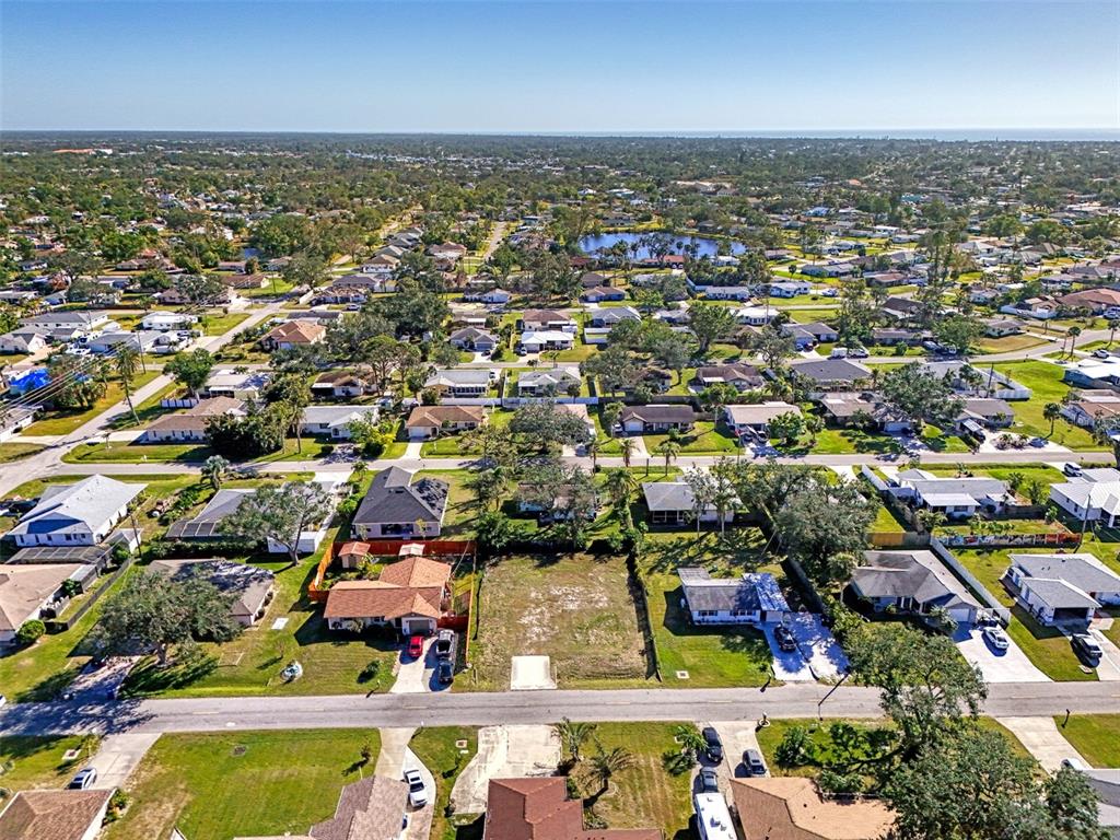 548 Morningside Road Venice, FL 34293 - Photo 19 of 22 an aerial view of residential building and lake