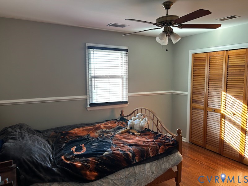 11707 Zilles Road Blackstone, VA 23824 - Photo 12 of 20 a bed sitting in a bedroom next to a window