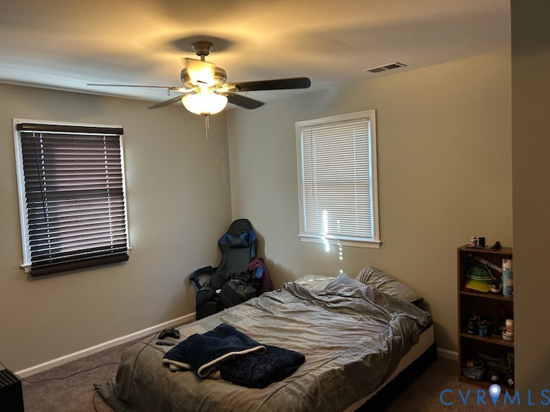 11707 Zilles Road Blackstone, VA 23824 - Photo 13 of 20 a bedroom with a bed and window