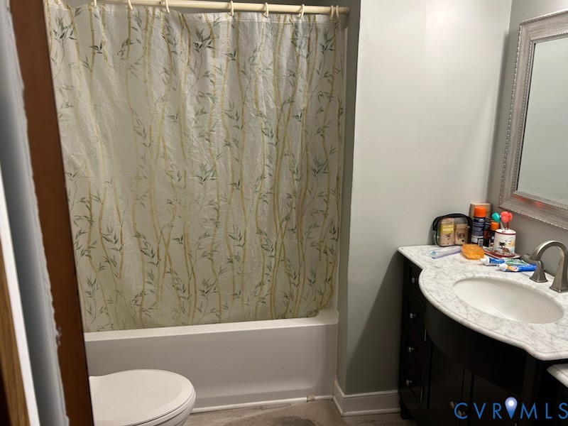 11707 Zilles Road Blackstone, VA 23824 - Photo 16 of 20 a bathroom with a sink toilet and shower