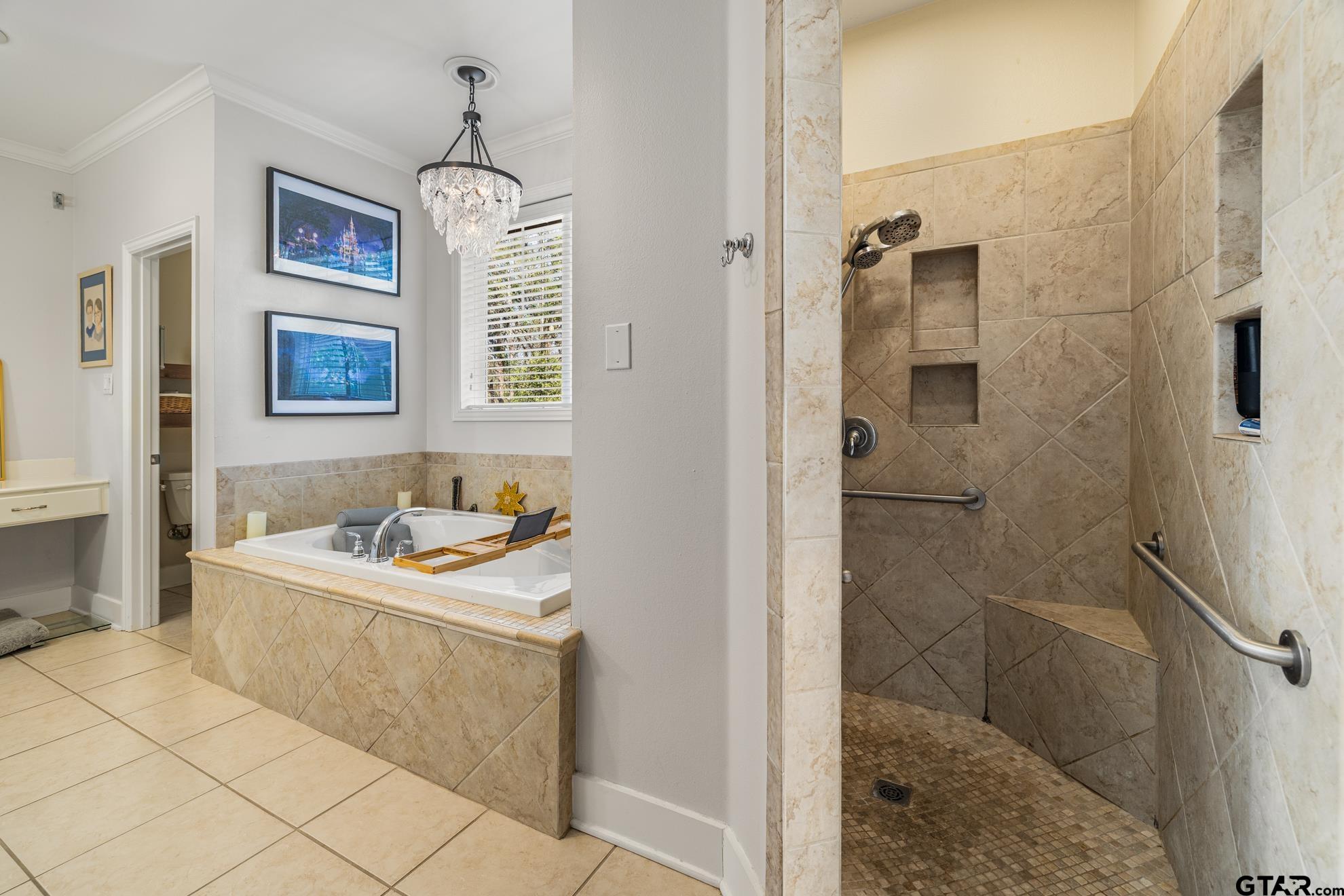 9453 Cherokee Trail Tyler, TX 75703 - Photo 18 of 40 a bathroom with a sink a vanity and a shower