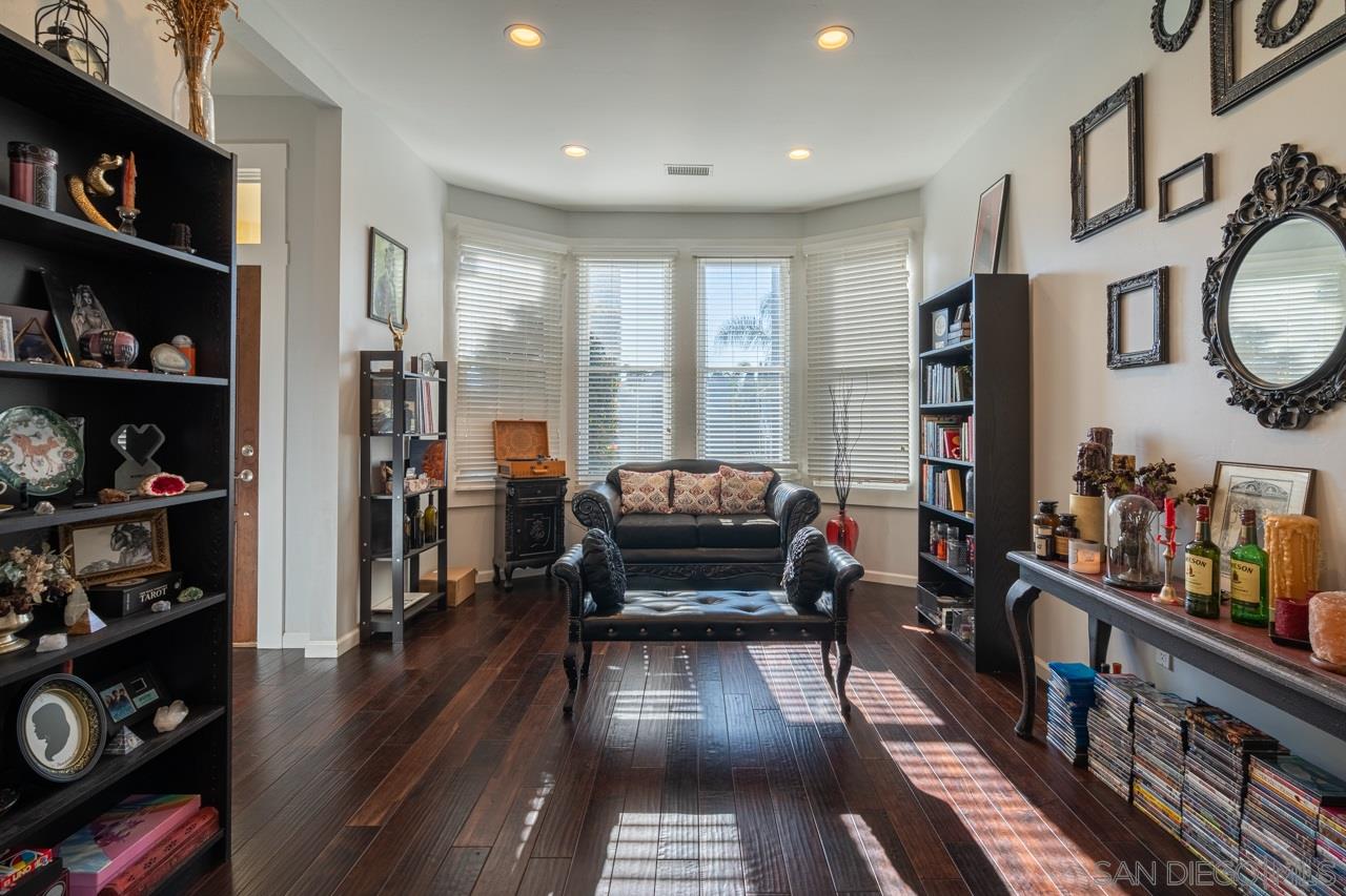 a living room with furniture cabinets and a book shelf
