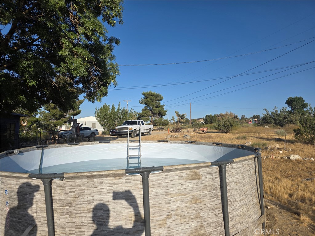 10623 Desert View Road Pinon Hills, CA 92372 - Photo 50 of 76 a view of a backyard of the house