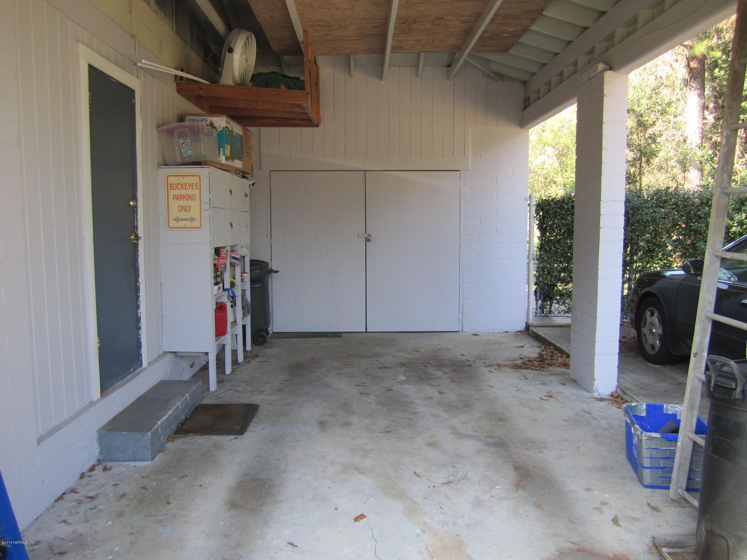 4677 Martingale Road Jacksonville, FL 32210 - Photo 21 of 24 Carport with storage and laundry