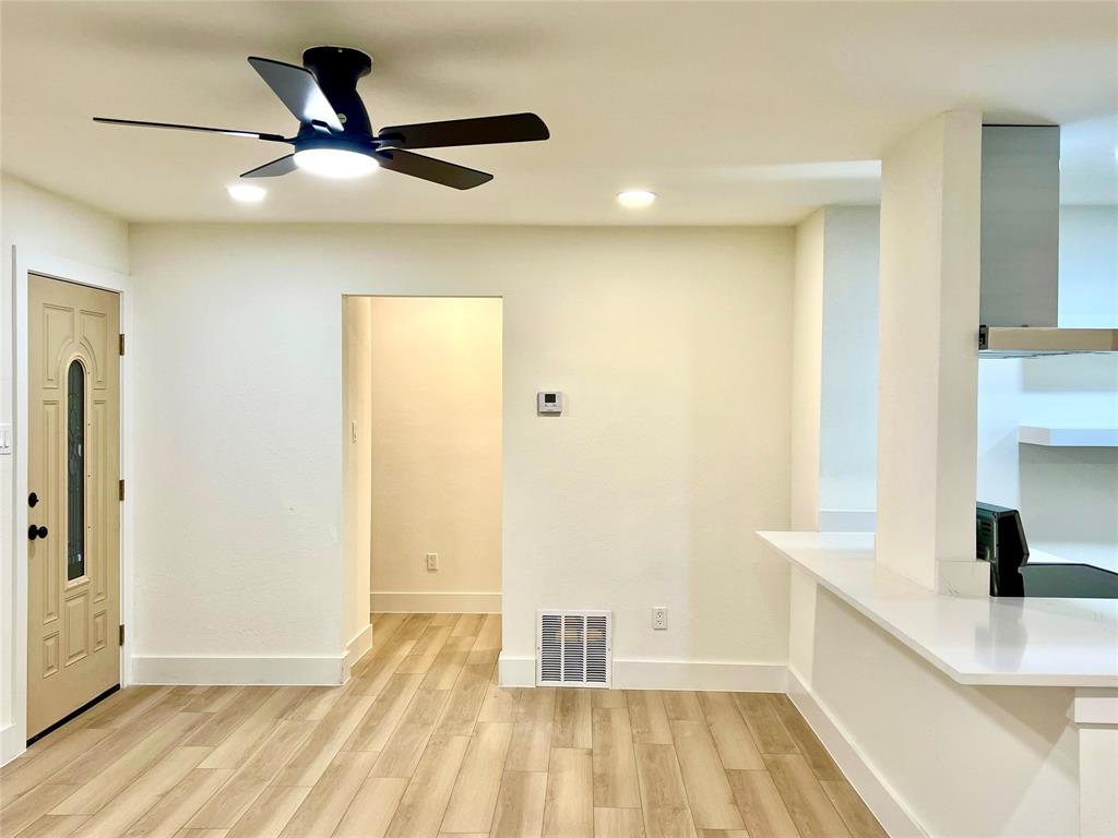 4211 Ridgedale Drive Mesquite, TX 75150 - Photo 5 of 11 a view of hallway with wooden floor and a carpet