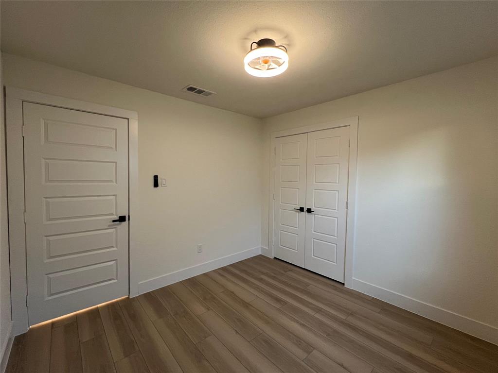 4211 Ridgedale Drive Mesquite, TX 75150 - Photo 8 of 11 wooden floor in an empty room