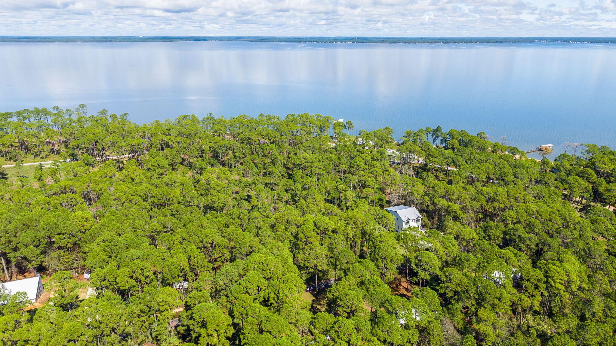 Lot 7-8 Crissman Road Santa Rosa Beach, FL 32459 - Photo 11 of 12 a view of a garden with a building in the background
