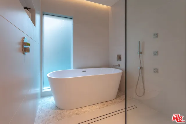 a white bath tub sitting in a bathroom