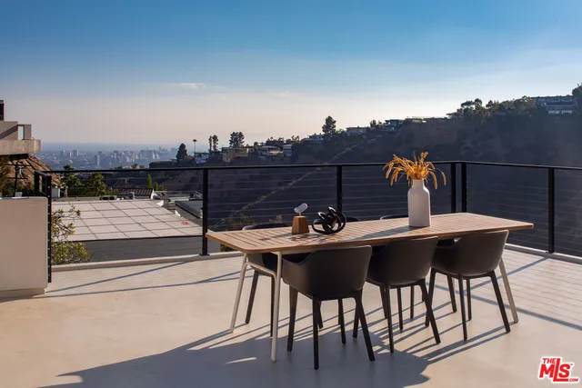 a terrace of a house with outdoor seating