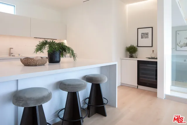 a kitchen with a table and chairs in it