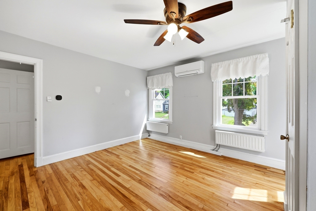 32 Lincoln Road Longmeadow, MA 01106 - Photo 26 of 36 a view of empty room with wooden floor and fan