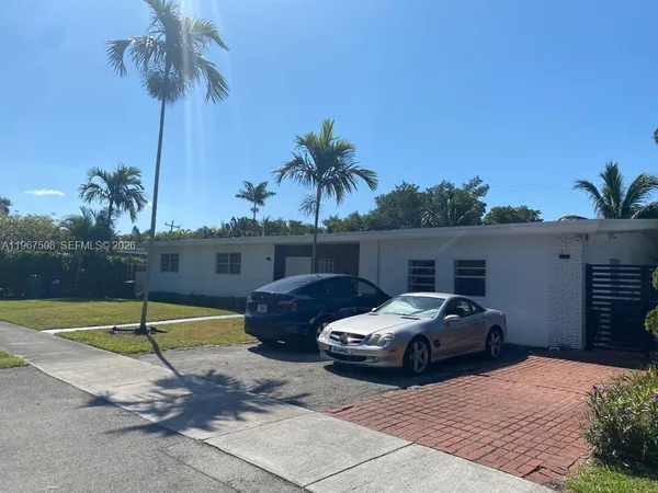 a view of a patio with couches and potted plants