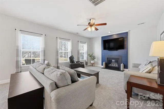 a living room with furniture white walls and white walls