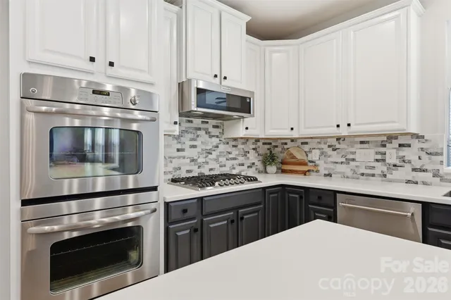 a view of a dining room with furniture and a window