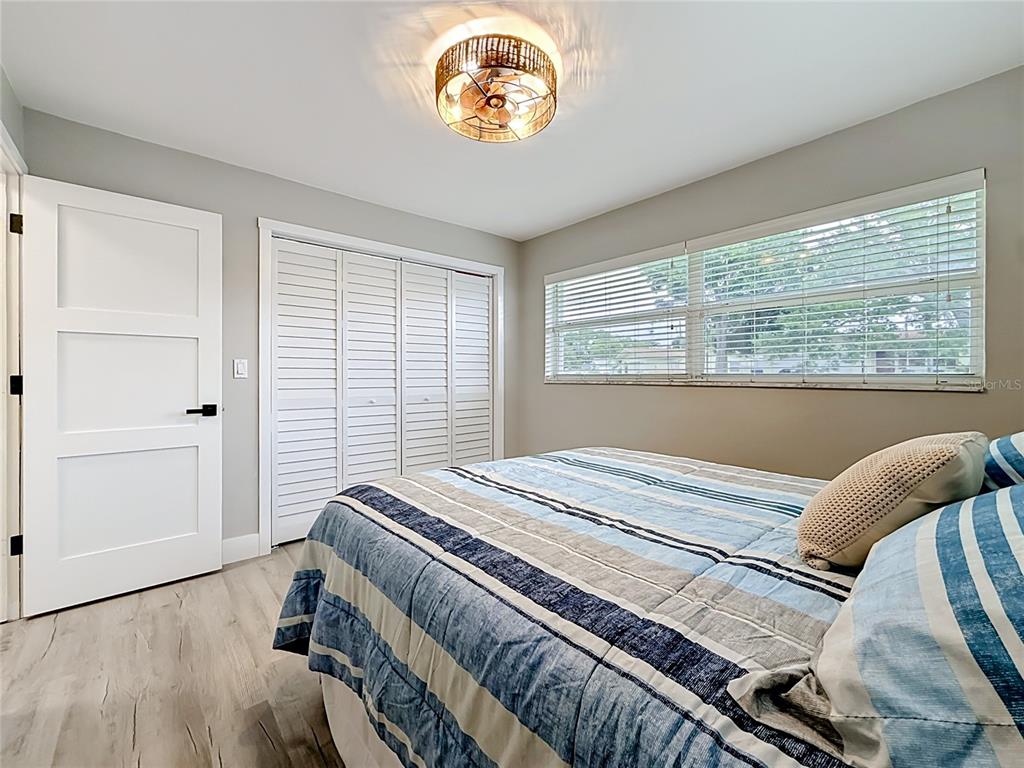 508 Shore Drive Largo, FL 33771 - Photo 17 of 31 a bedroom with a bed and a window