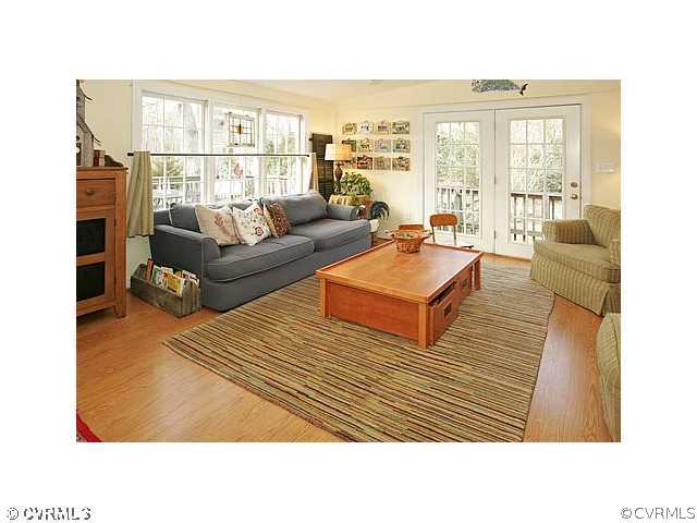 2650 Radstock Road Midlothian, VA 23113 - Photo 3 of 12 a living room with furniture and a floor to ceiling window