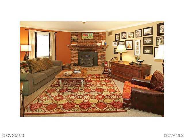 2650 Radstock Road Midlothian, VA 23113 - Photo 6 of 12 a living room with furniture and a floor to ceiling window