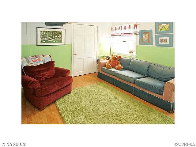 2650 Radstock Road Midlothian, VA 23113 - Photo 7 of 12 a living room with furniture and a rug
