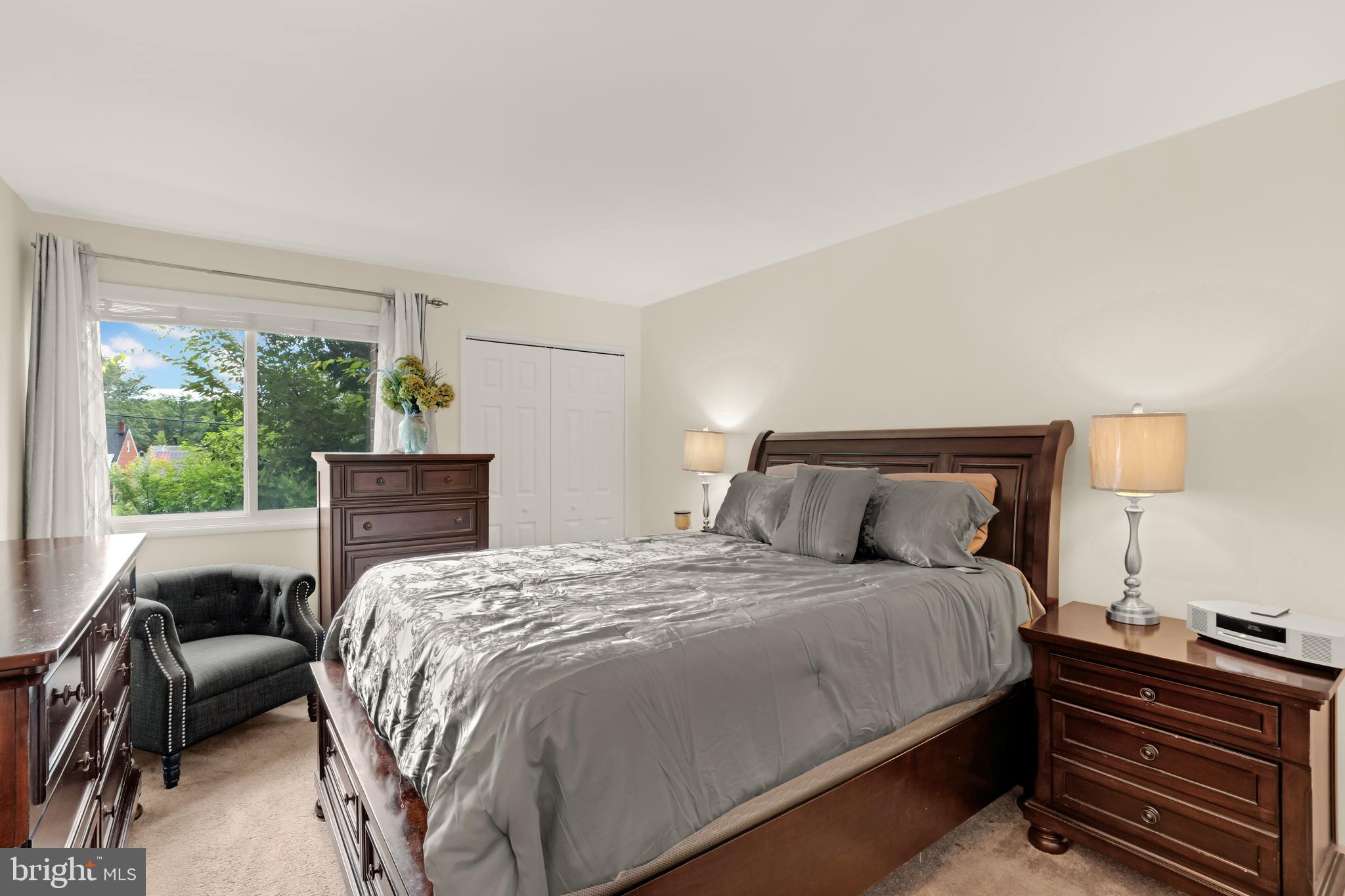 7318 Donnell Place, Unit C4 District Heights, MD 20747 - Photo 12 of 14 a bedroom with a bed and a couch