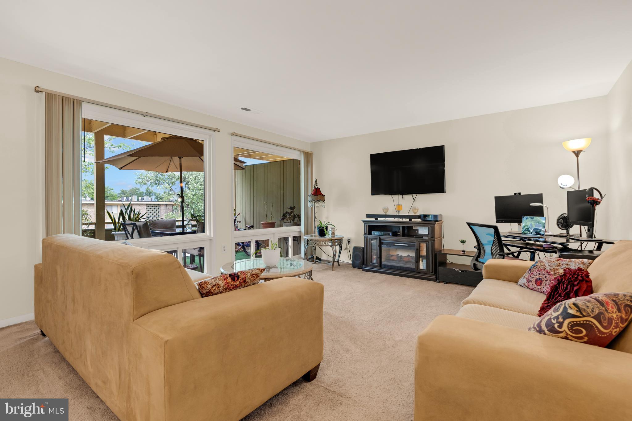 7318 Donnell Place, Unit C4 District Heights, MD 20747 - Photo 2 of 14 a living room with furniture and a flat screen tv