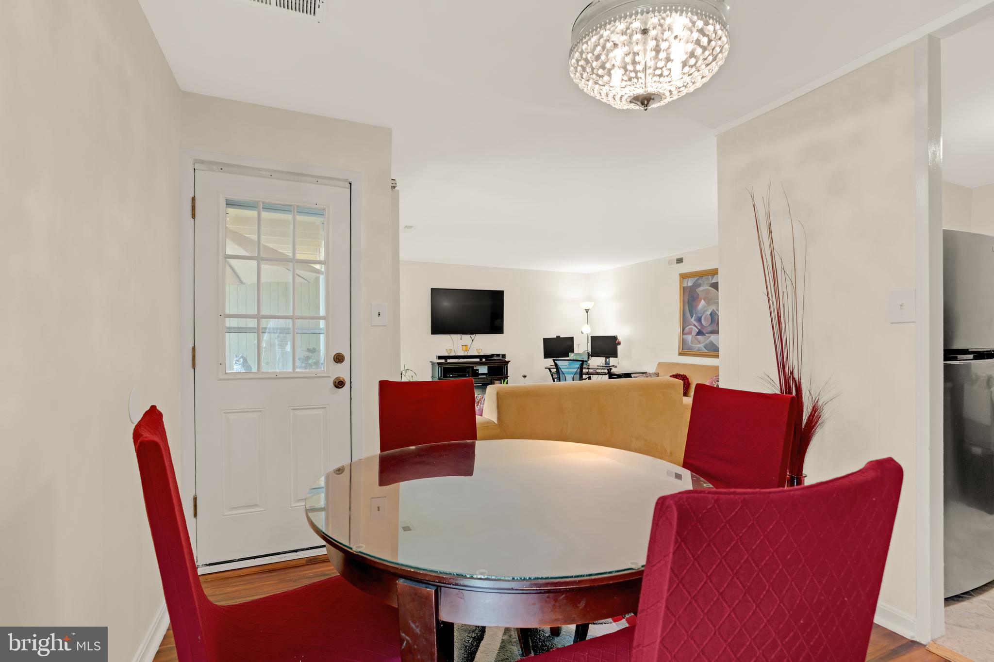 7318 Donnell Place, Unit C4 District Heights, MD 20747 - Photo 8 of 14 a living room with furniture a flat screen tv and a window