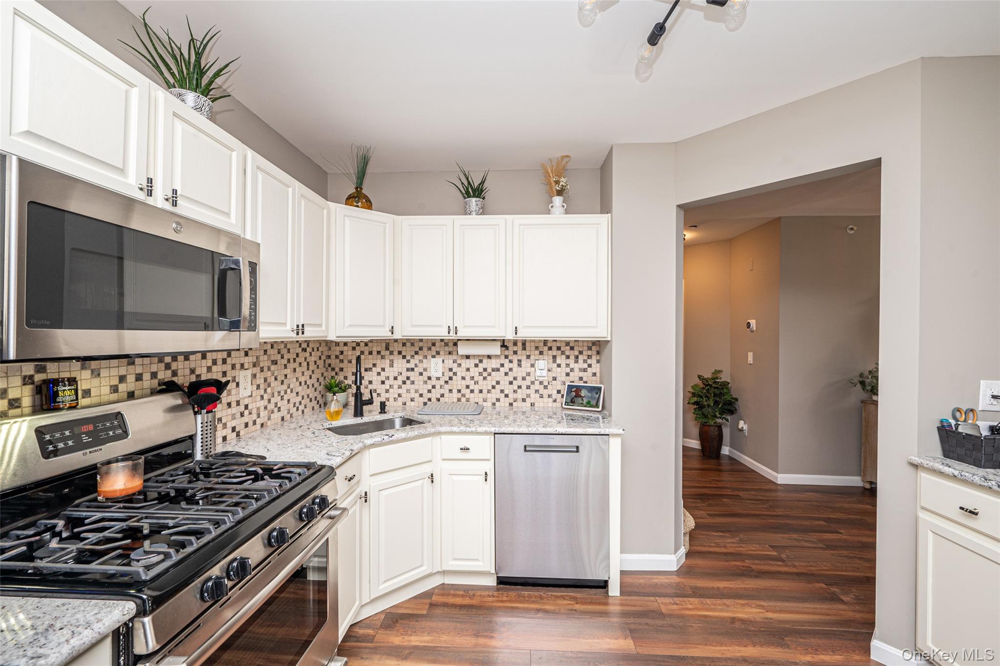 1 Casey Lane Middle Island, NY 11953 - Photo 11 of 35 a kitchen with a stove and a white cabinets