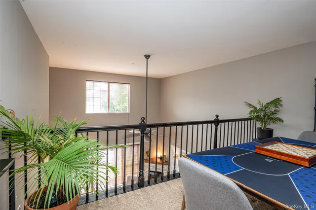 a view of a livingroom with furniture and staircase
