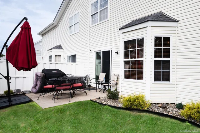 a backyard of a house with seating space