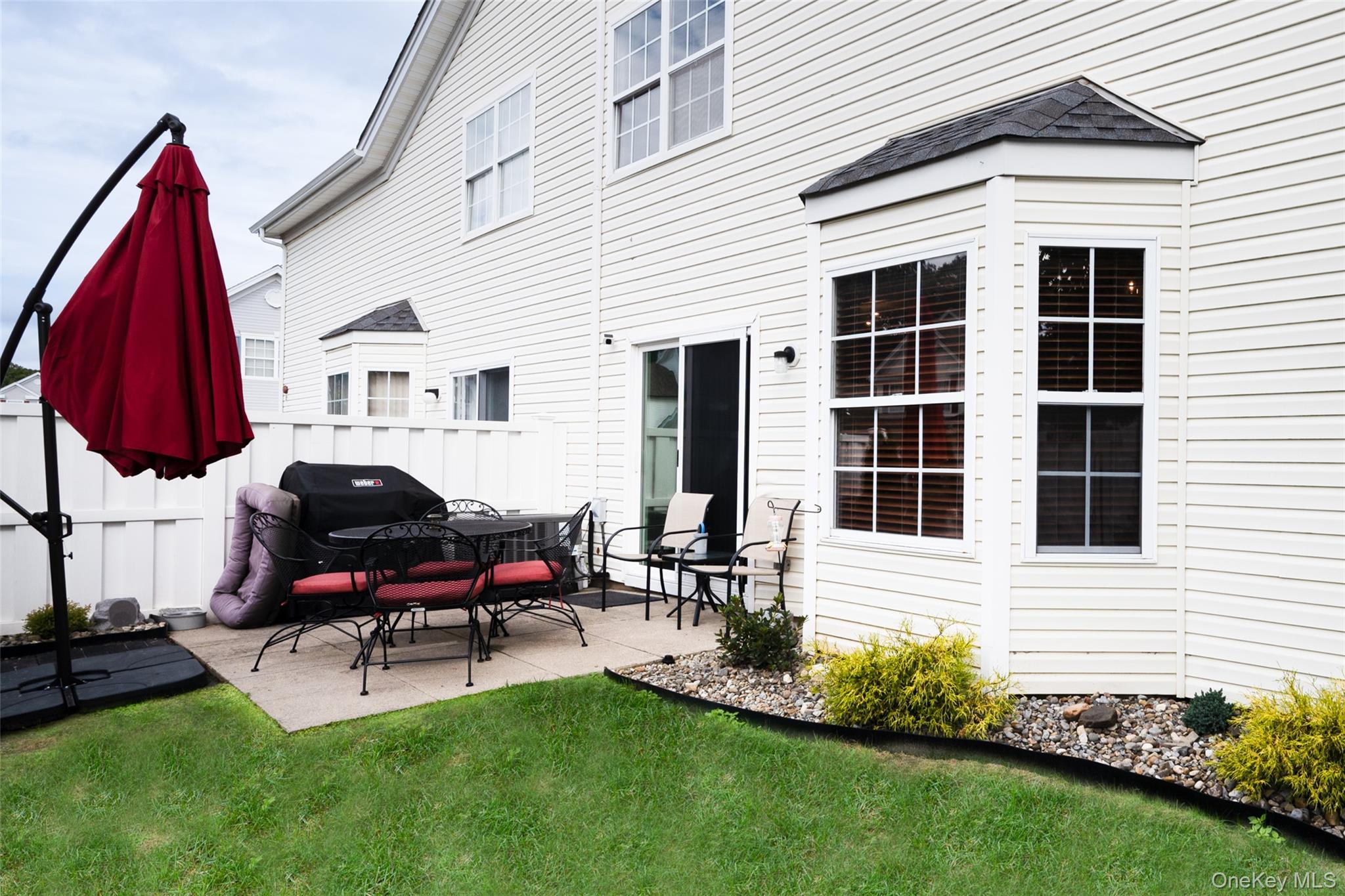 1 Casey Lane Middle Island, NY 11953 - Photo 27 of 35 a backyard of a house with seating space