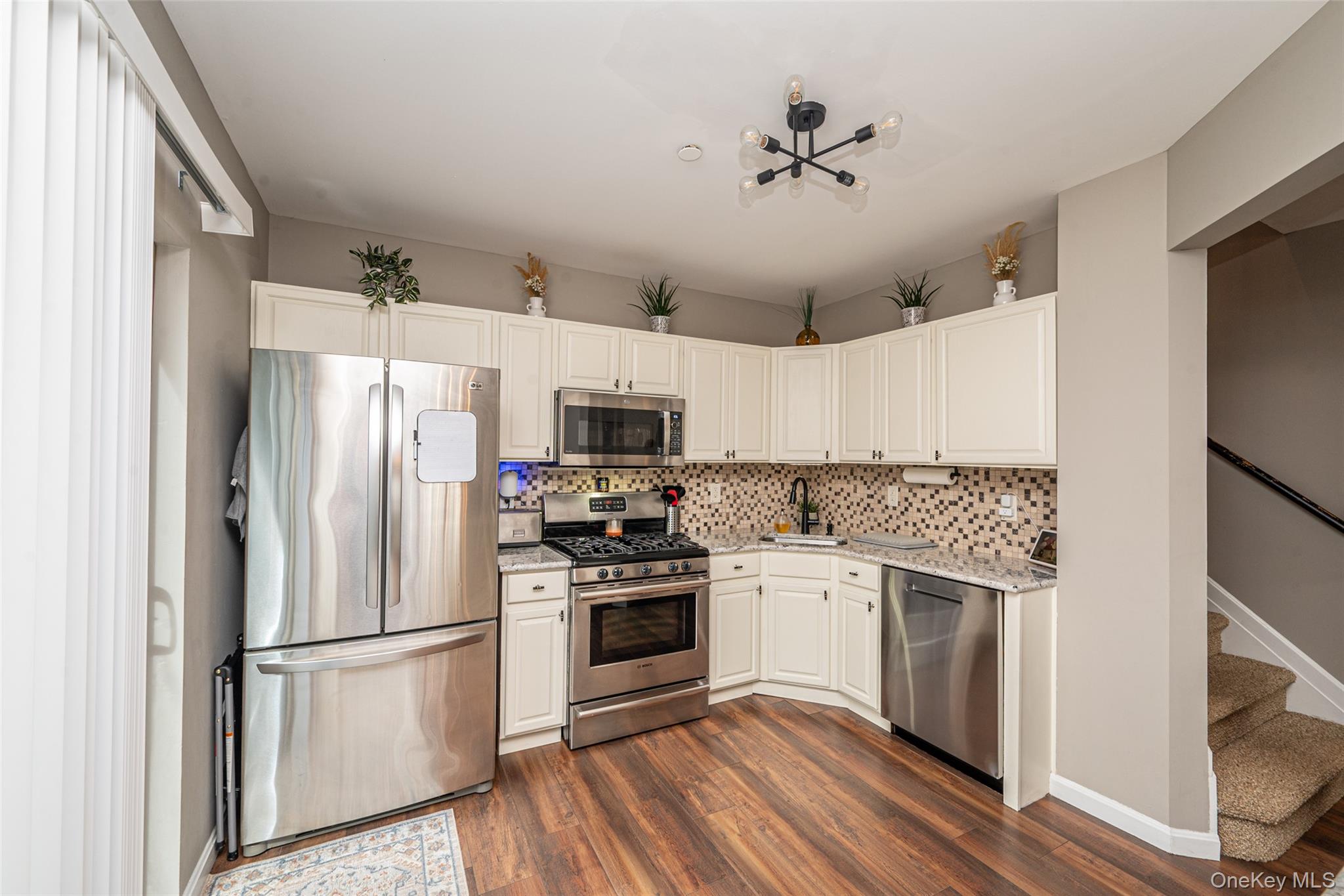 1 Casey Lane Middle Island, NY 11953 - Photo 9 of 35 a kitchen with stainless steel appliances a refrigerator sink and stove
