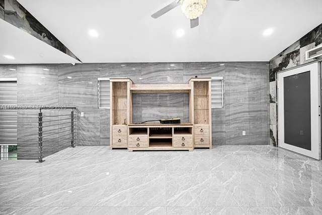 a bed room with a bed and a television