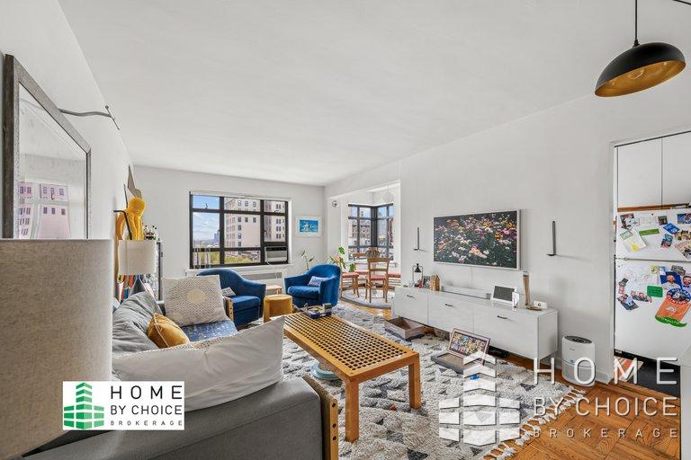 100 Remsen Street, Unit 8A Brooklyn, NY 11201 - Photo 4 of 14 a living room with furniture and a flat screen tv