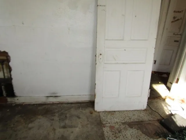 a view of a room with wooden walls