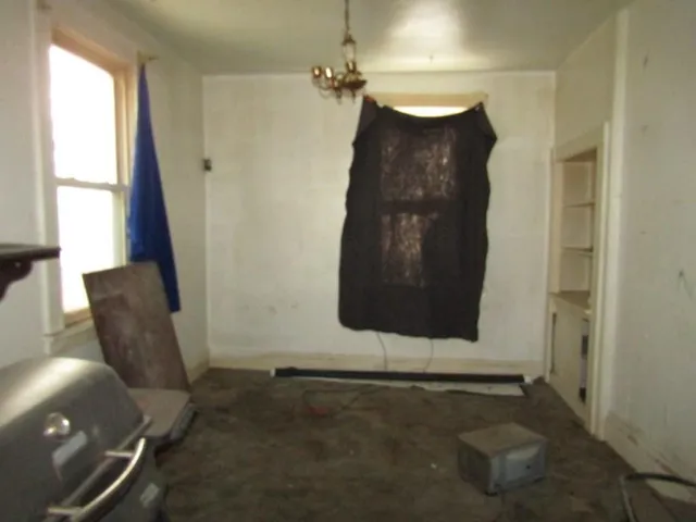 a room with furniture and a window