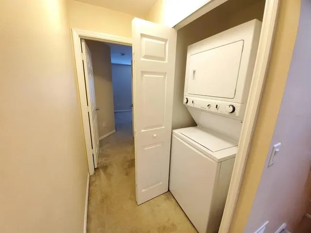a bathroom with a granite countertop sink toilet mirror vanity and shower