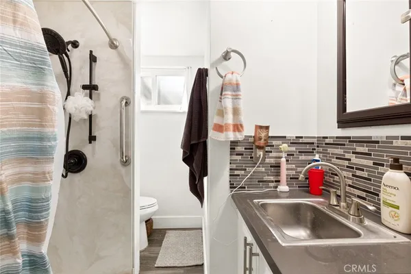 a bathroom with a sink and mirror