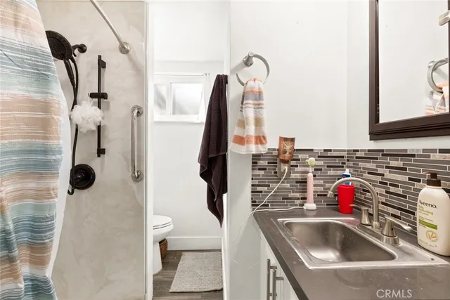 a bathroom with a sink and mirror