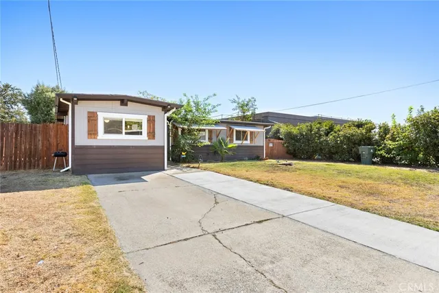 a house view with a backyard space