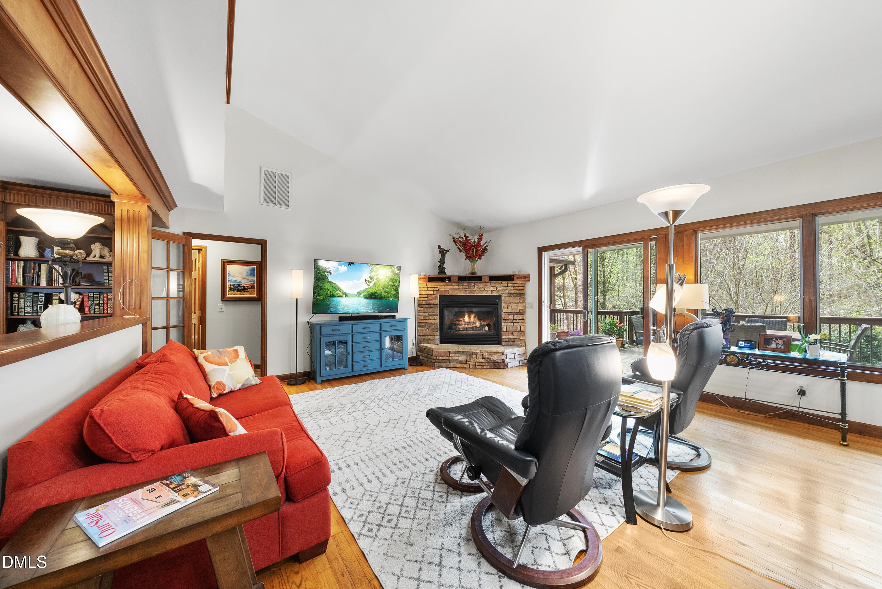 6200 Splitrock Trail Apex, NC 27539 - Photo 11 of 64 a living room with furniture fireplace and a large window