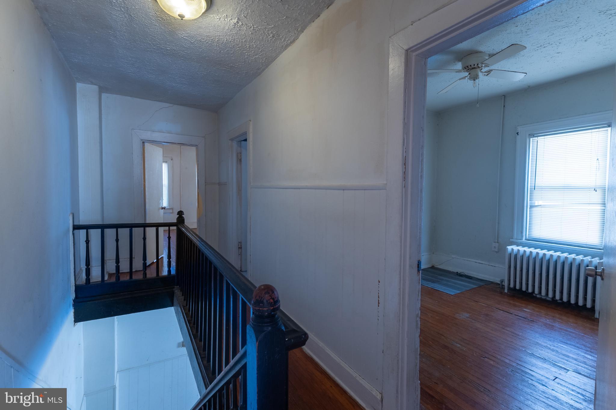5911 Crown Street Capitol Heights, MD 20743 - Photo 12 of 28 a view of hallway with wooden floor and stairs